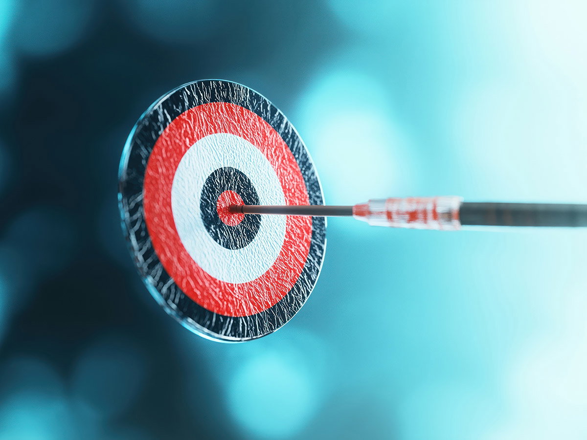 Precision targeted therapy concept illustrated by dart hitting bullseye of target