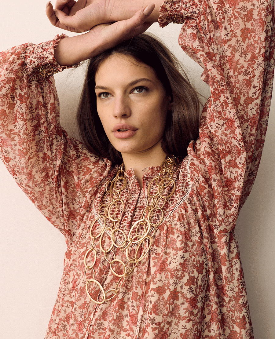 GIF of woman wearing Per Una Printed Ladder Lace Insert Mini Smock Dress in Pink Mix