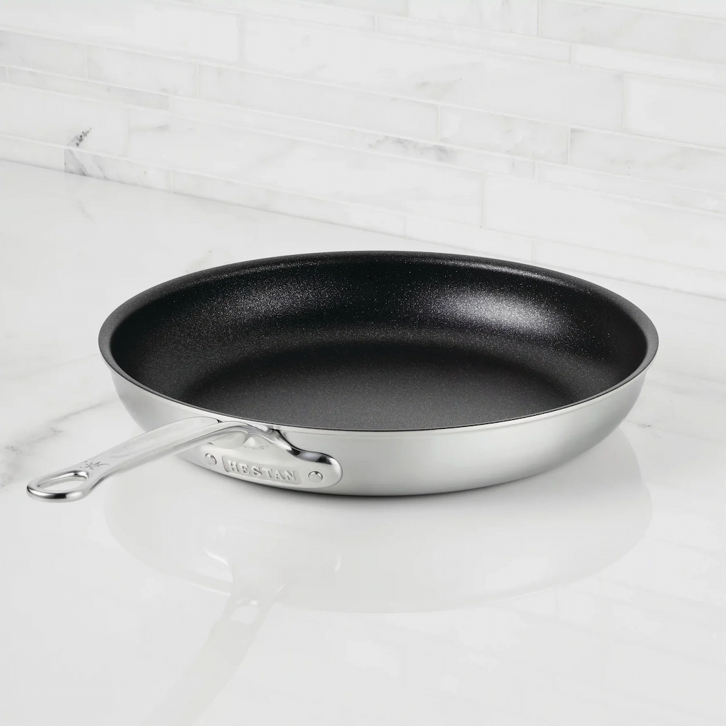 IMG: Thomas Keller Commercial Clad with TITUM® Nonstick Skillet on marble countertop