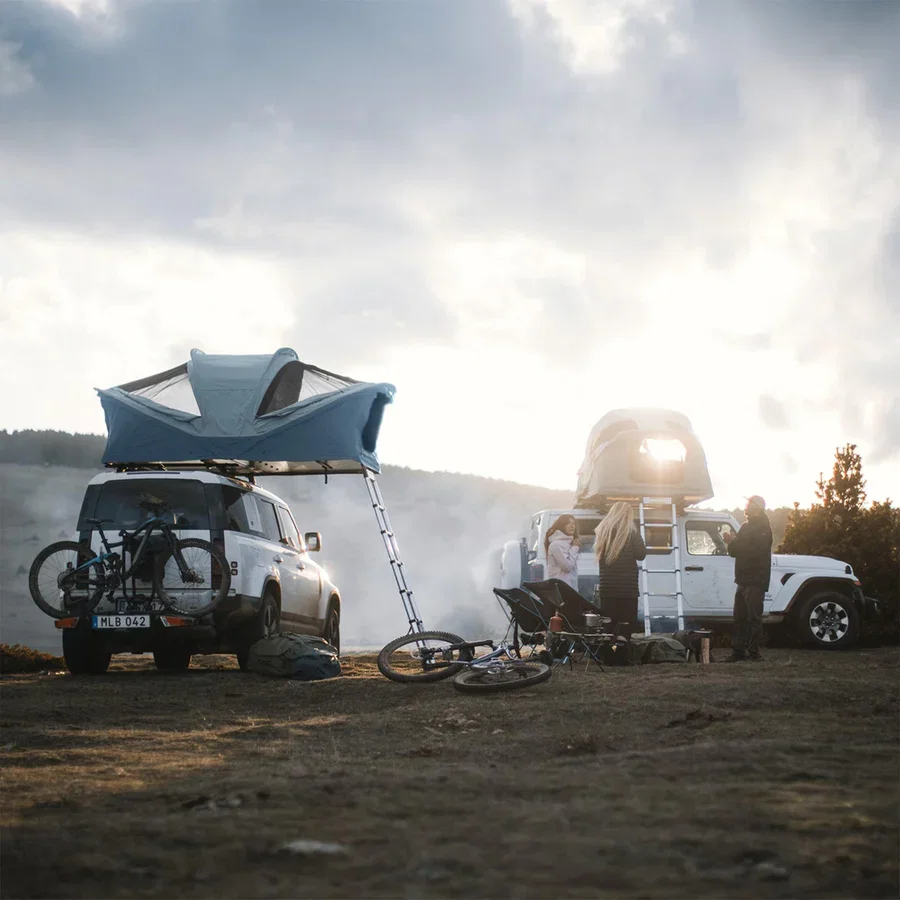 A Thule Roof Tent pitched on top of a 4x4.