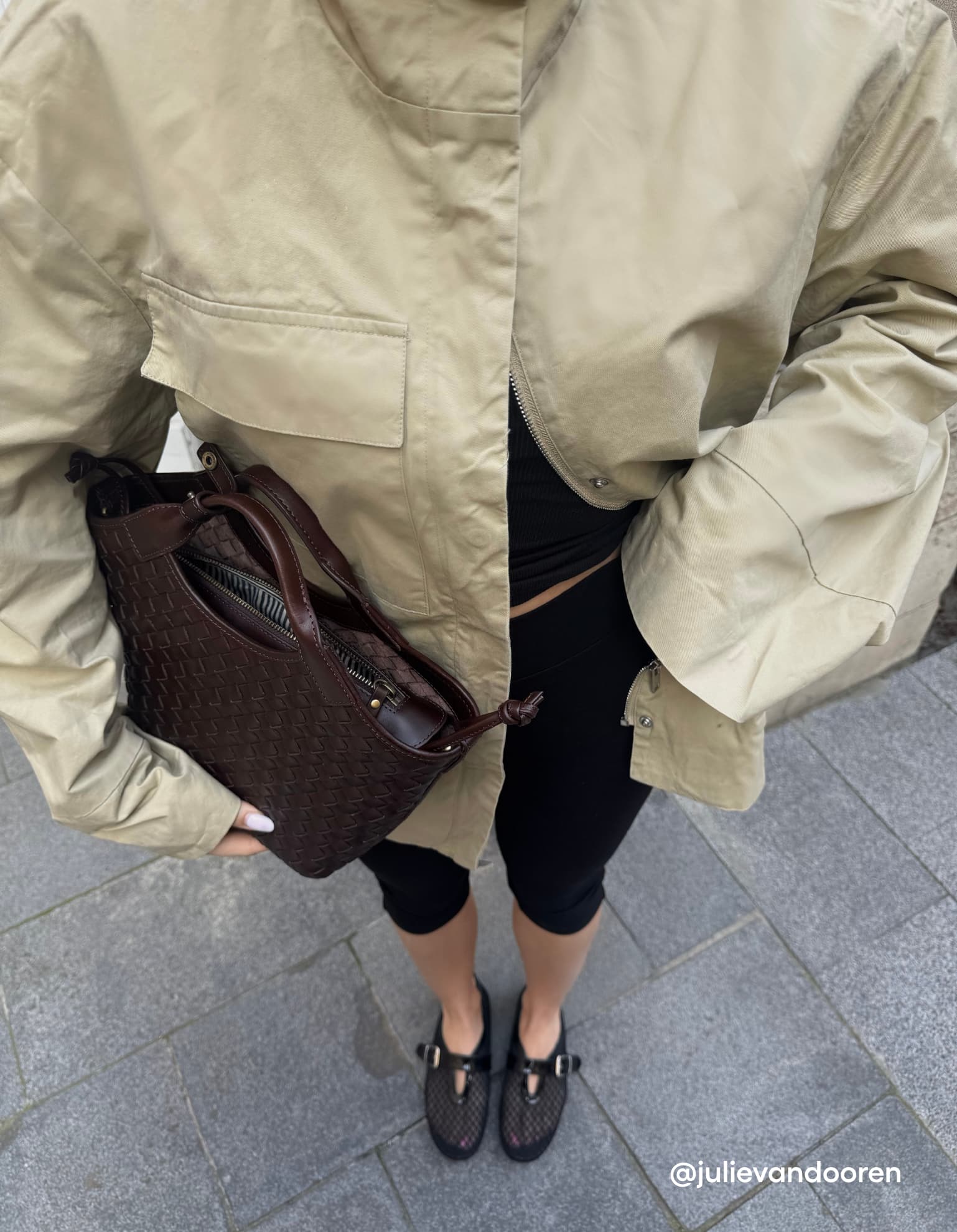 Woman holding the Mara Midi in Chocolate