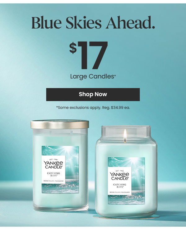 Blue skies ahead sale ad, large Yankee Candles for $17, shop now button, two candles shown.