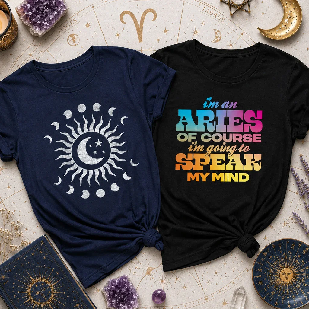 Two astrology-themed t-shirts displayed on a zodiac background with crystals and celestial decorations.