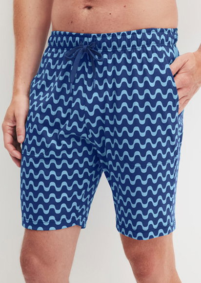 Patterned Bermuda shorts in “Mazarine Blue” with side pockets and an elastic waistband from the REMIX SLEEP TIME OFF collection by CALIDA. 