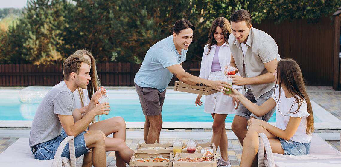 Friends gathering by a pool