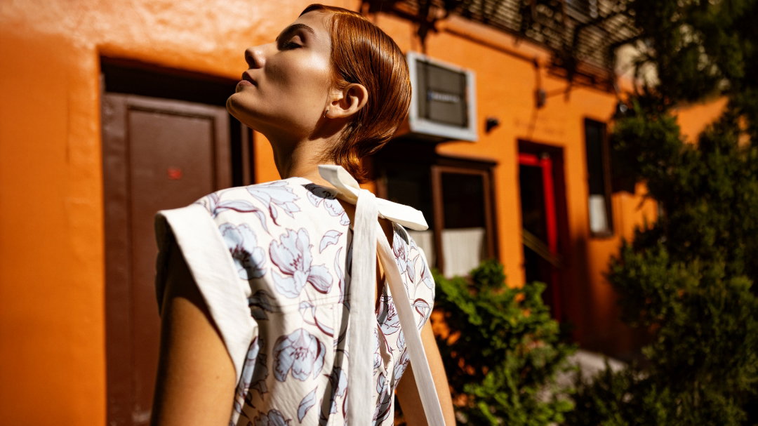 an image of a woman standing on the side of a street
