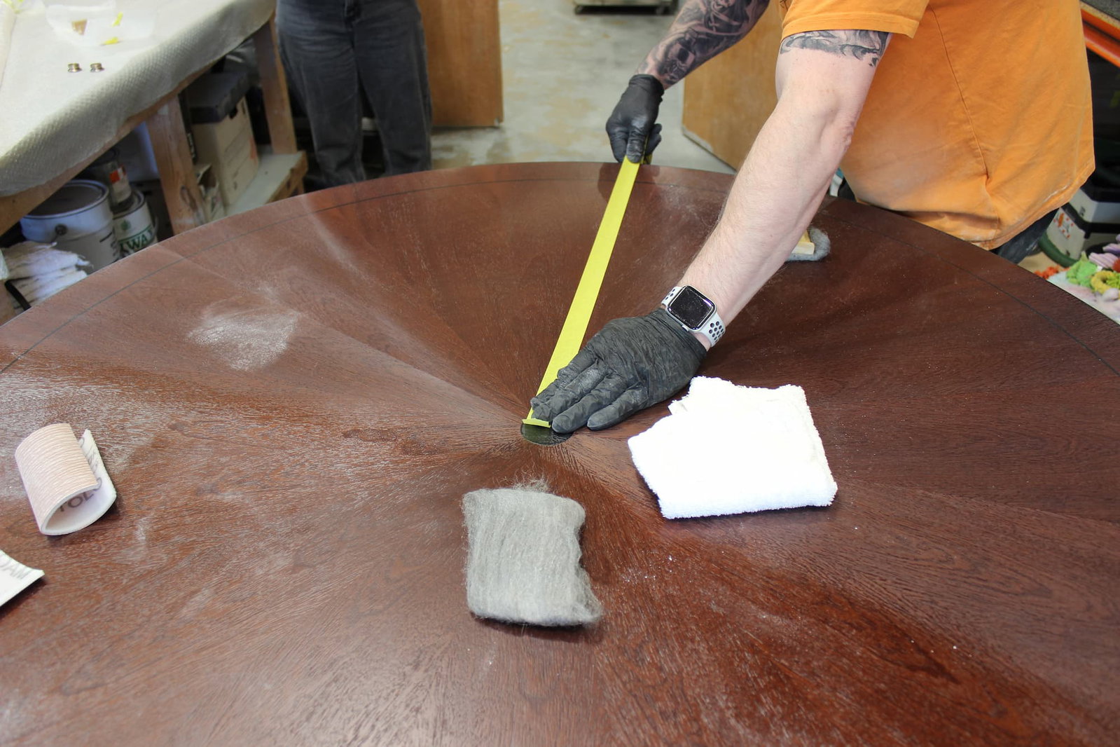 Tiffany dining table being hand polished 