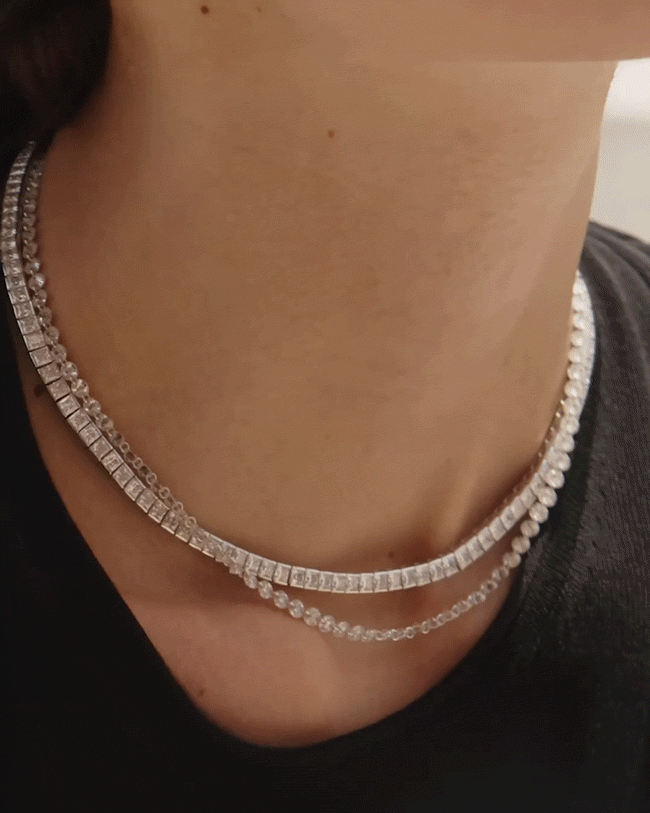 GIF of model wearing the Princess-Cut Riviere Necklace and the Floating Eternity Necklace