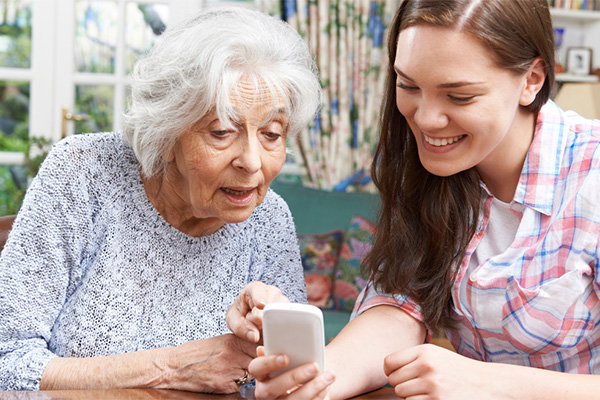 two women looking at phone 