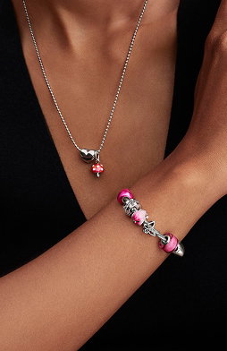 Pandora bracelet and necklace worn on model