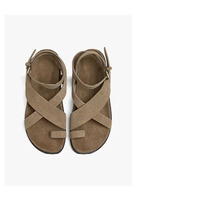 Flat leather sandals with crossed straps
