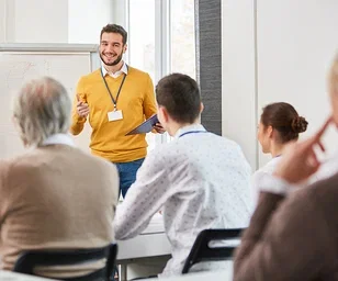 image-person-giving-presentation-in-front-of-small-class