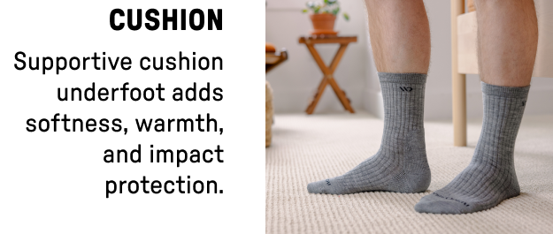 Man's legs in gray cushioned crew socks - cushion provides softness, warmth, and impact protection.