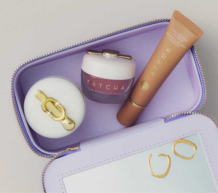 An image of Tatcha's exclusive vanity case filled with a selection of Tatcha lip products