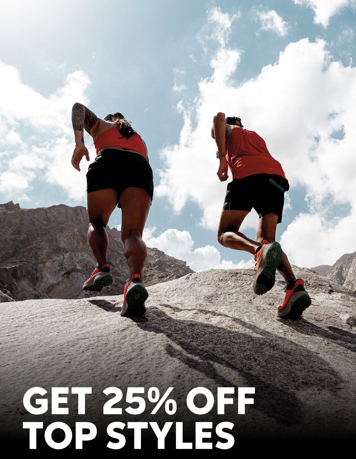 Two runners scrambling up a rock, wearing red and black running gear with text: GET 25% OFF TOP STYLES