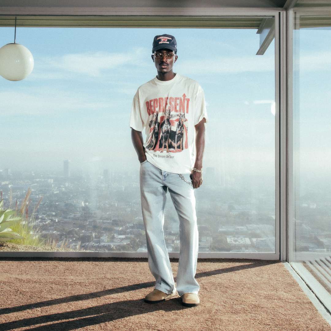 Model wearing the SS26 Dream On Tour T-Shirt in Washed Ecru