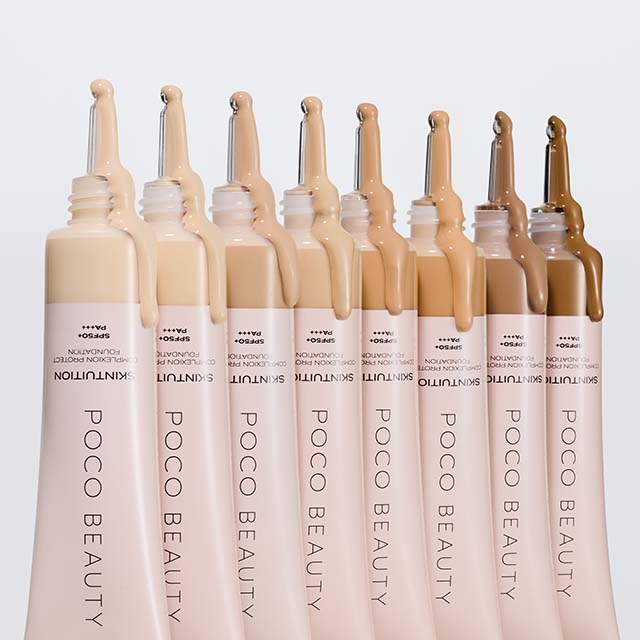 Nine tubes of Poco Beauty foundation in various shades, lined up in a row.