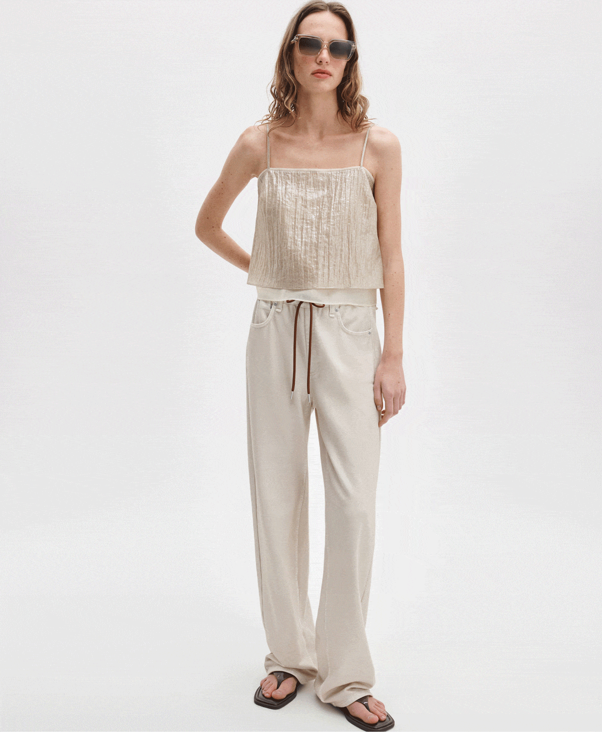 Ecru cotton terry with a burnt sienna drawstring. The laid-back sweatpant jeans you already love are ready for summer. Shop them only through the link below. 