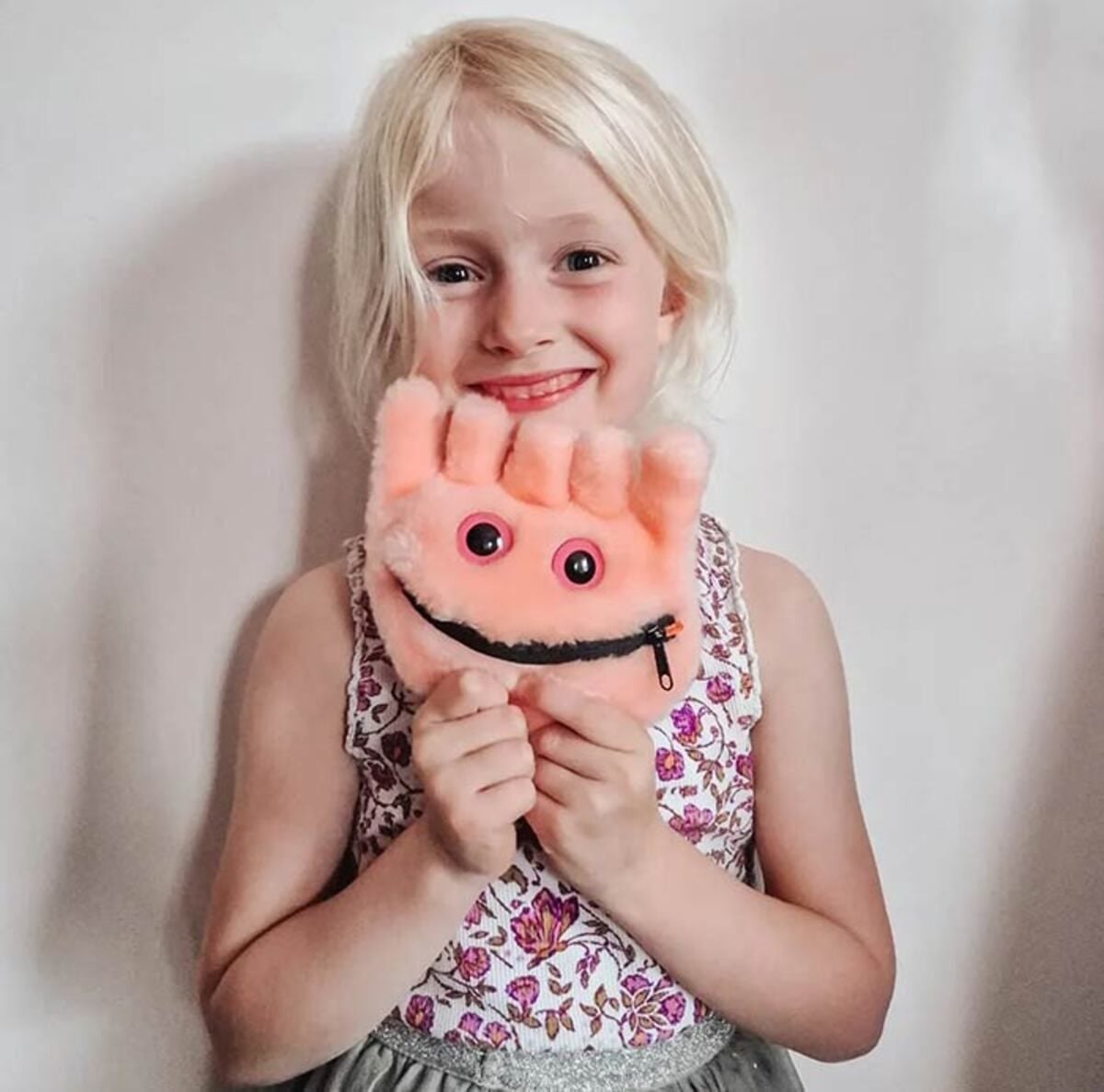 Child with happy Celiac plush