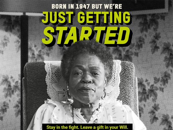 an image of a woman sat on an armchair, looking directly at the camera. Overlaid is the text “Born in 1947 but we’re just getting started,” below is the text “Stay in the fight. Leave a gift in your Will.”