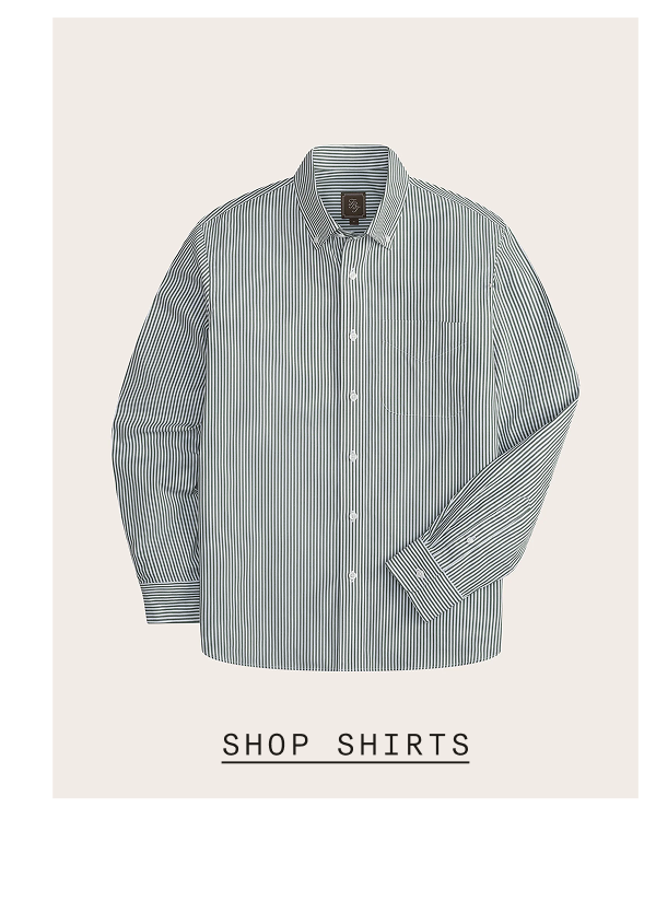 Navy and white striped button-down dress shirt with point collar and button cuffs, displayed flat against a light cream background. SHOP SHIRTS