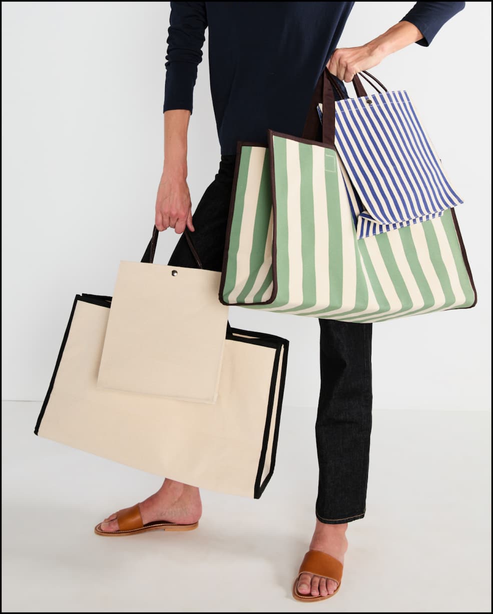 Model carrying the Tula and Lucia bags
