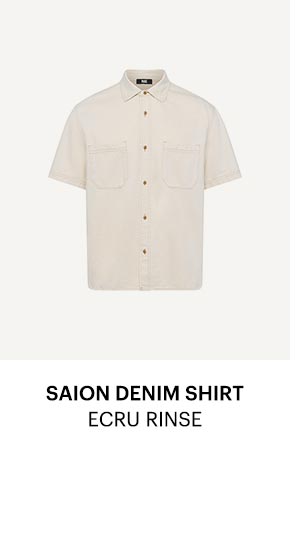 An image of an ecru colored short sleeve denim shirt - Shop the Saion Denim Shirt in Ecru Rinse.