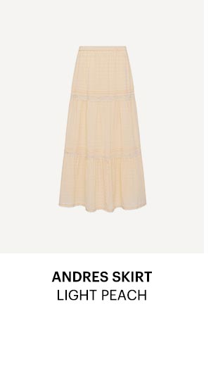 An image of a light peach colored flowy maxi skirt - Shop the Andres Skirt in Light Peach.