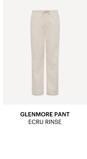 An image of ecru colored light denim wide leg pants with tie waist detail - Shop the Glenmore Pant in Ecru Rinse.