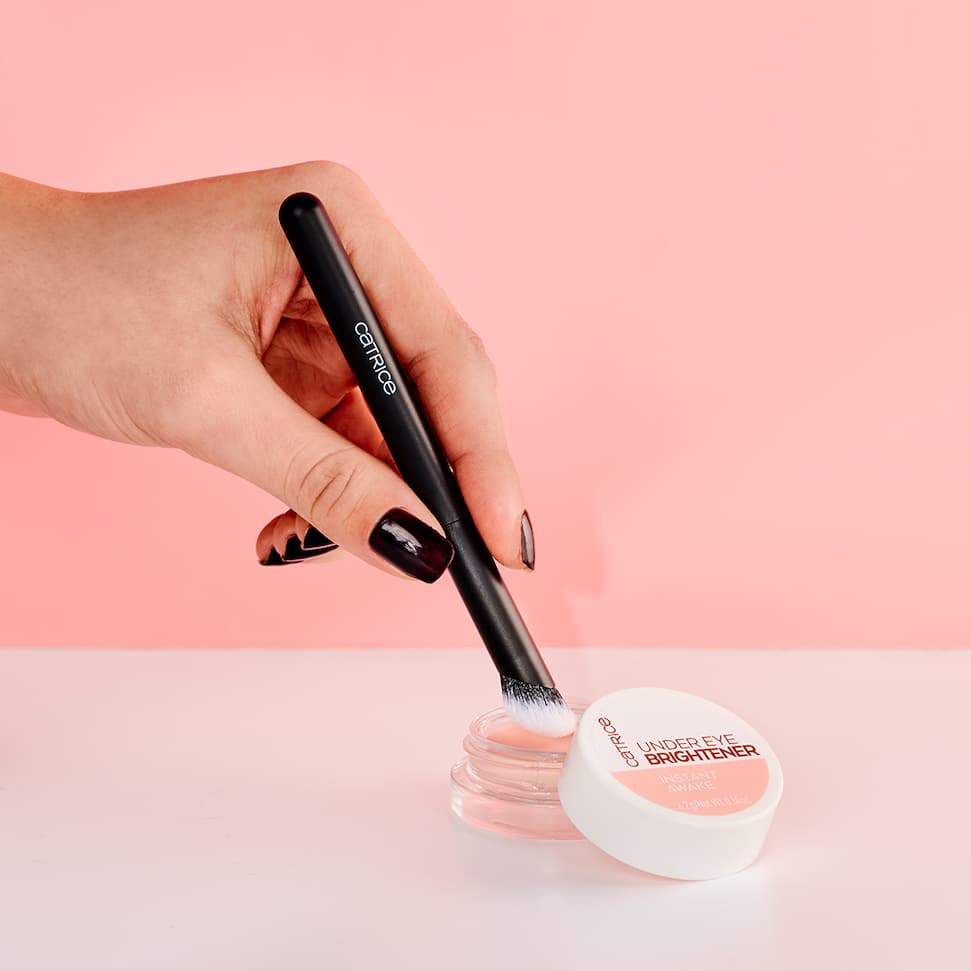 Step 1. Start by using the Catrice Concealer Brush to pick up a small amount of under-eye brightener.