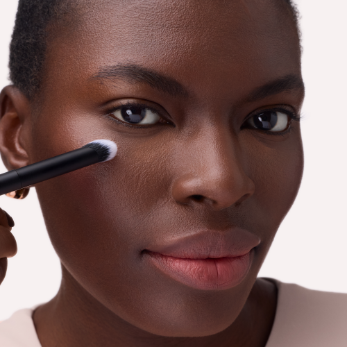  Step 2. Gently blend the product under the eyes, starting at the inner corner and working outward for a seamless finish.