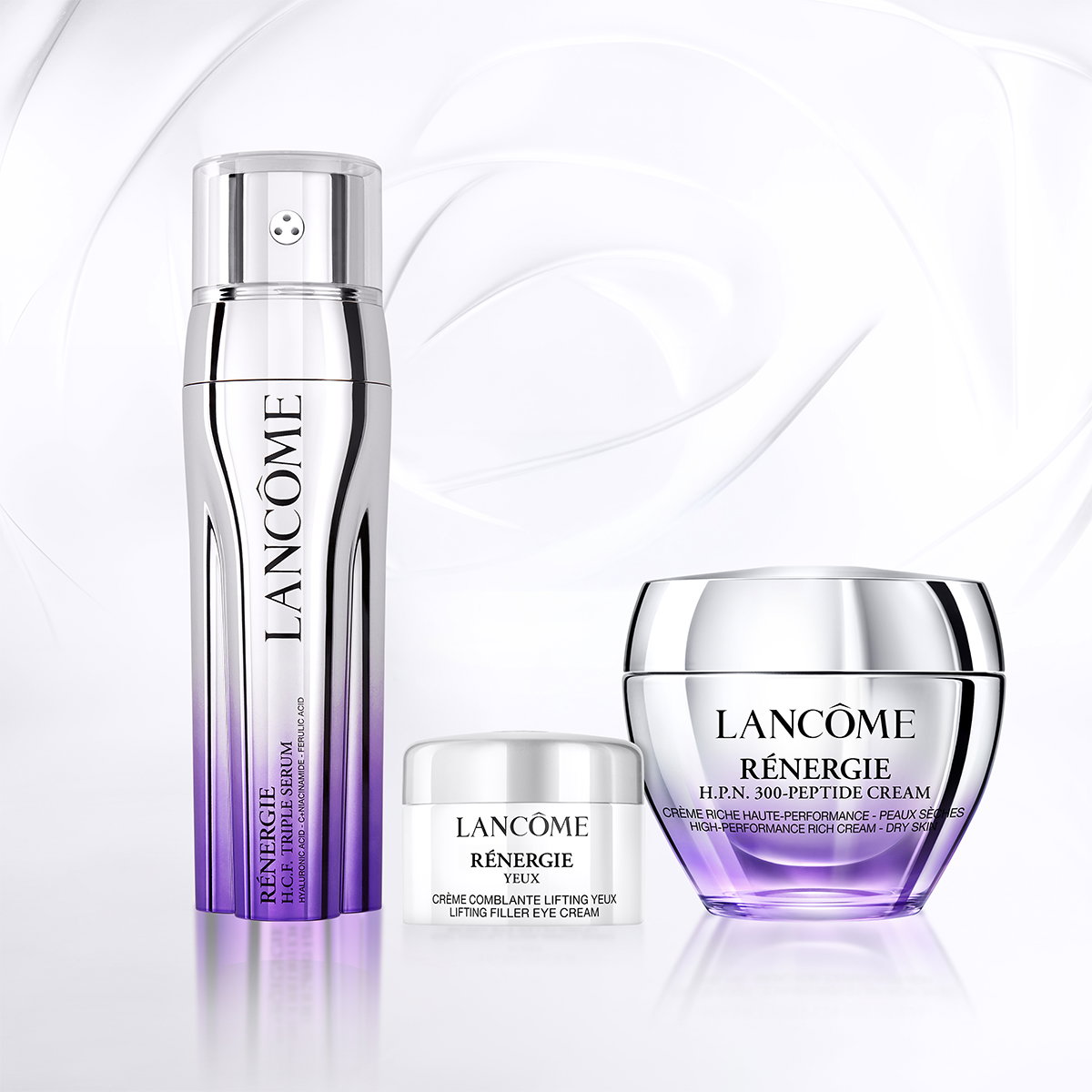 Routine Lancôme Rénergie: siero H.C.F. Triple Serum, crema contorno occhi Yeux e crema H.P.N. 300-Peptide su sfondo bianco