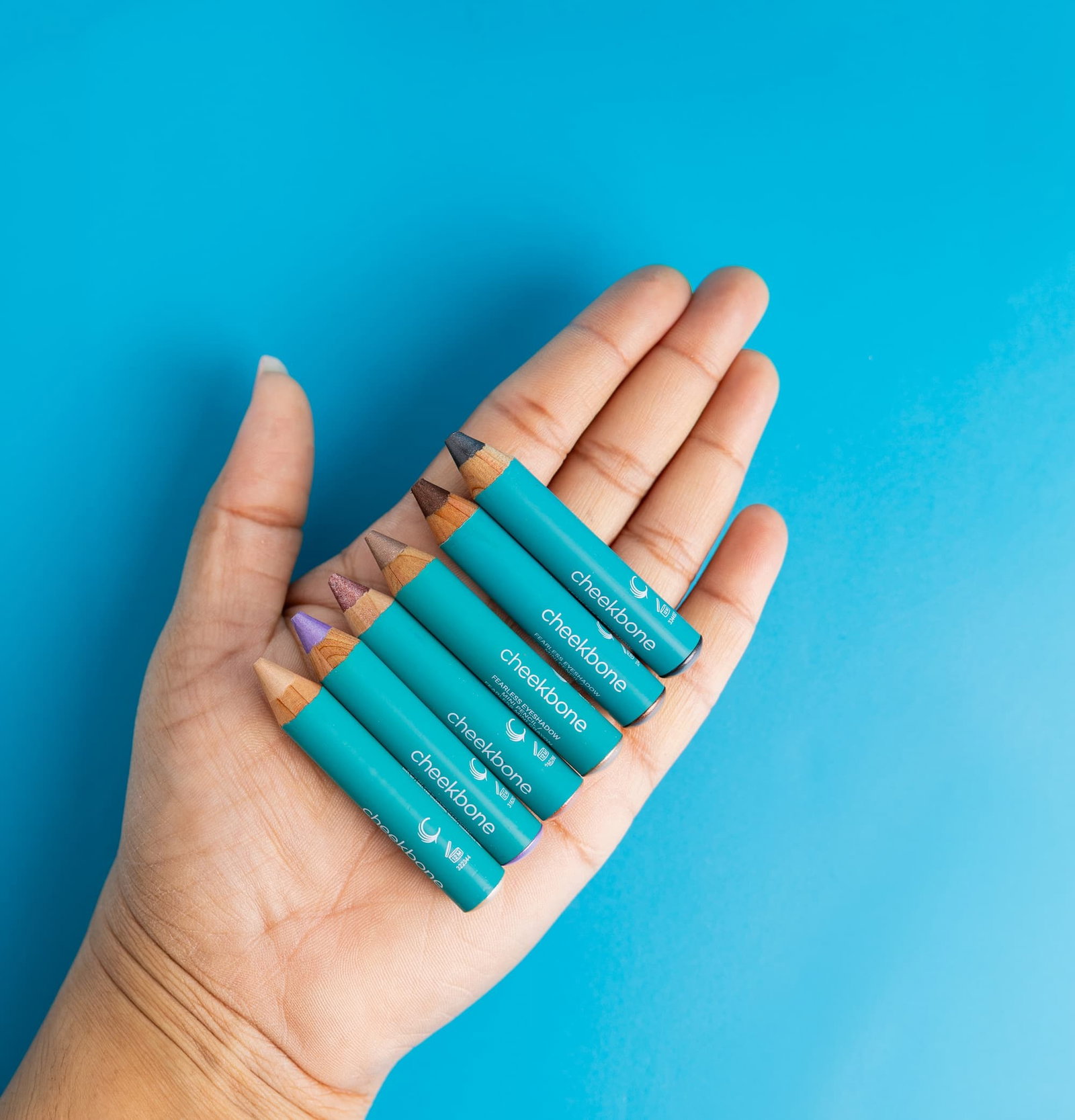 hand holding mini eyeshadows