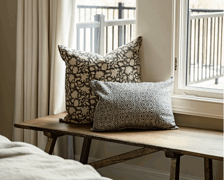 Neutral pillows add a primary bedroom