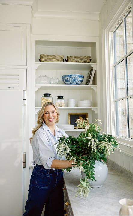 Jesse styling florals in the Side Kitchen