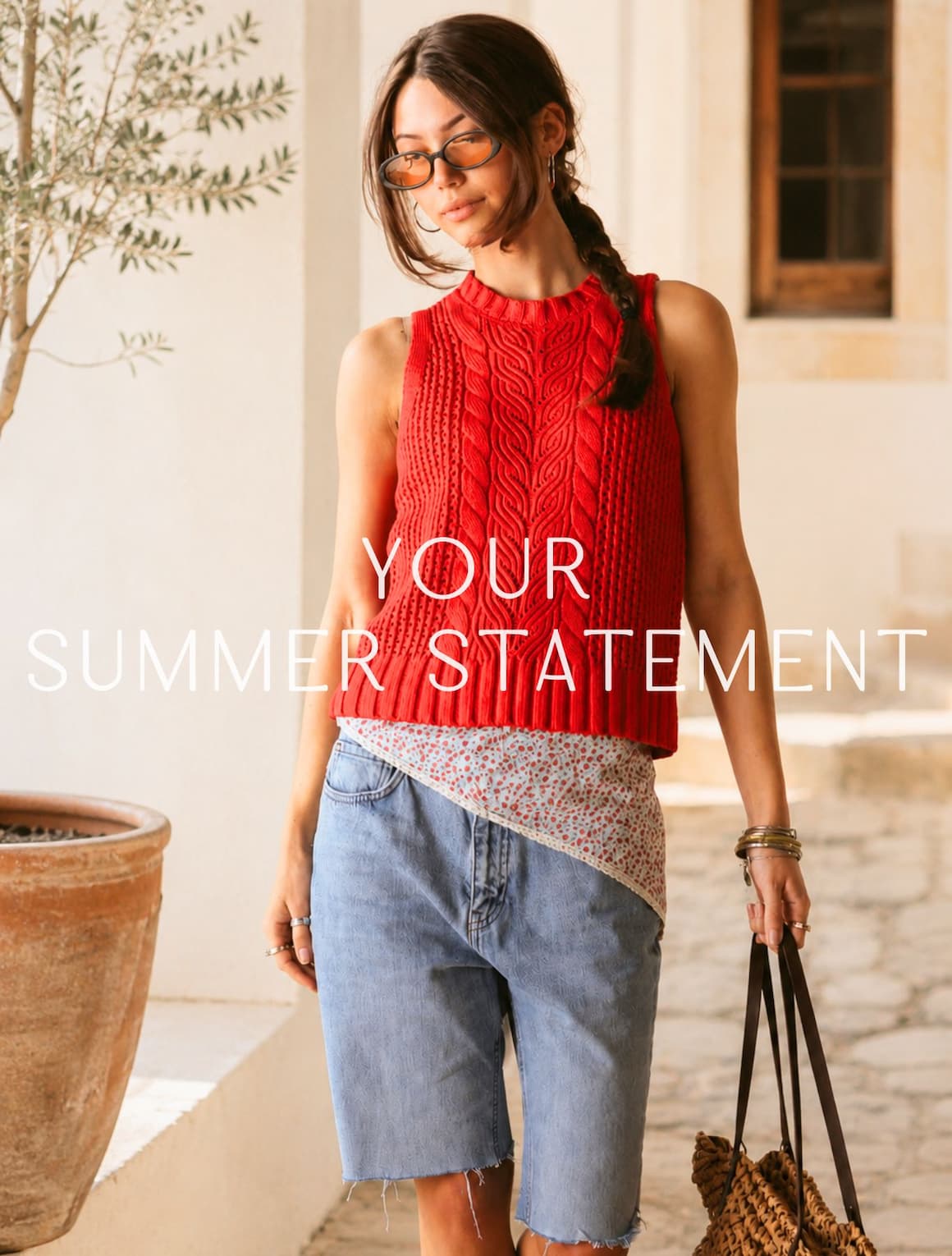 A lady wearing a red linen blend texture knit tank