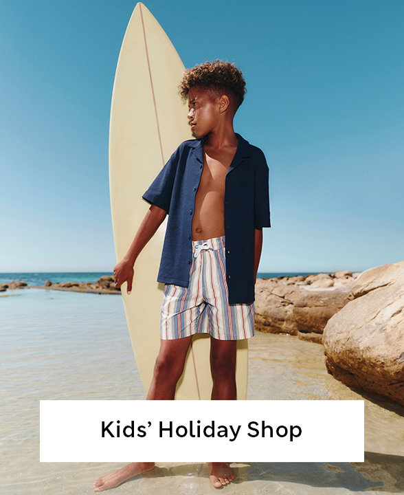 Boy wearing Blue Shirt and Mix Striped Swim Shorts