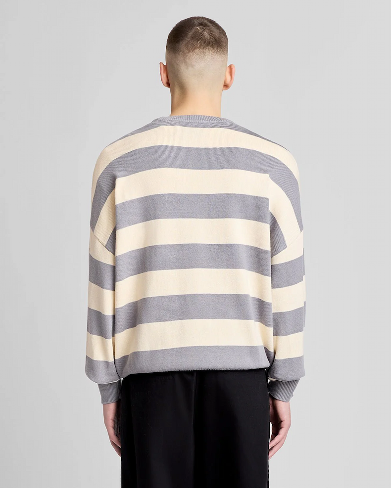 Model wears Striped Script Embroidered Knitted Jumper