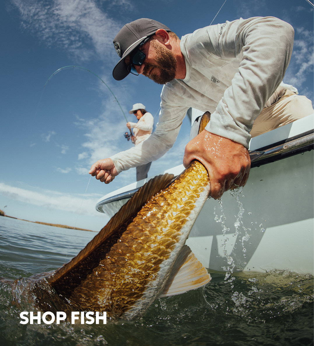 Two anglers pulling fish onto a boat with text: SHOP FISH