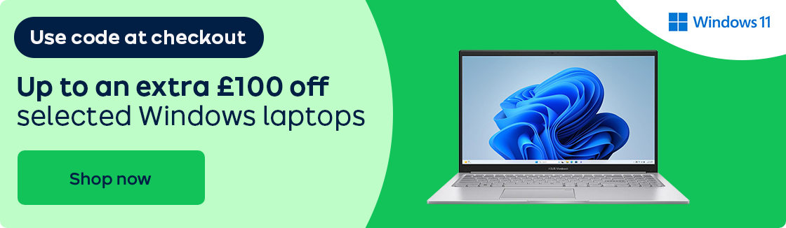 A laptop against a green background.