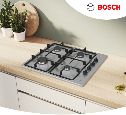 A stainless steel Bosch hob on a wooden worktop.