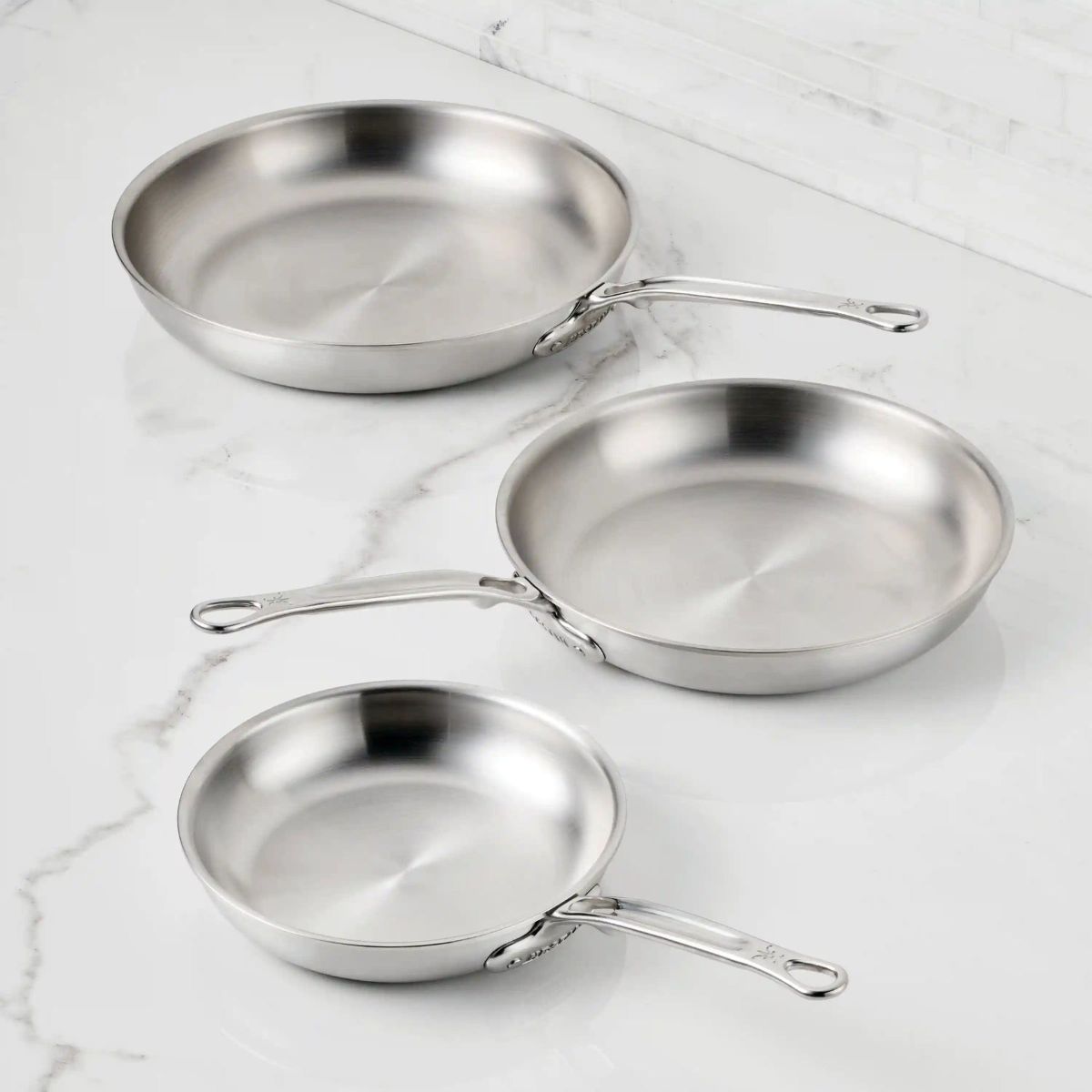 IMG: Stainless Steel Skillets on marble countertop