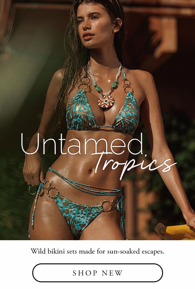Model wearing an aqua leopard bikini with gold hardware. Shop new. 