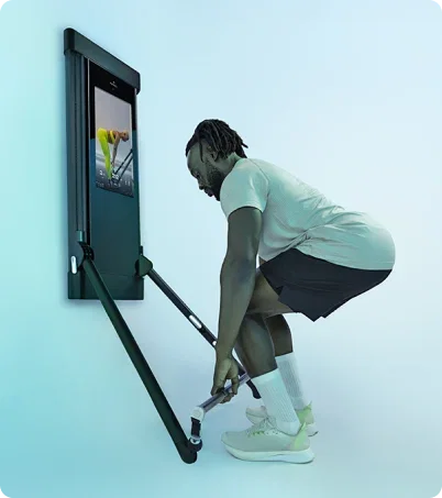 Man working out with Tonal 2 Smart Home Gym in industrial loft