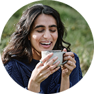 Woman bringing a mug to her lips