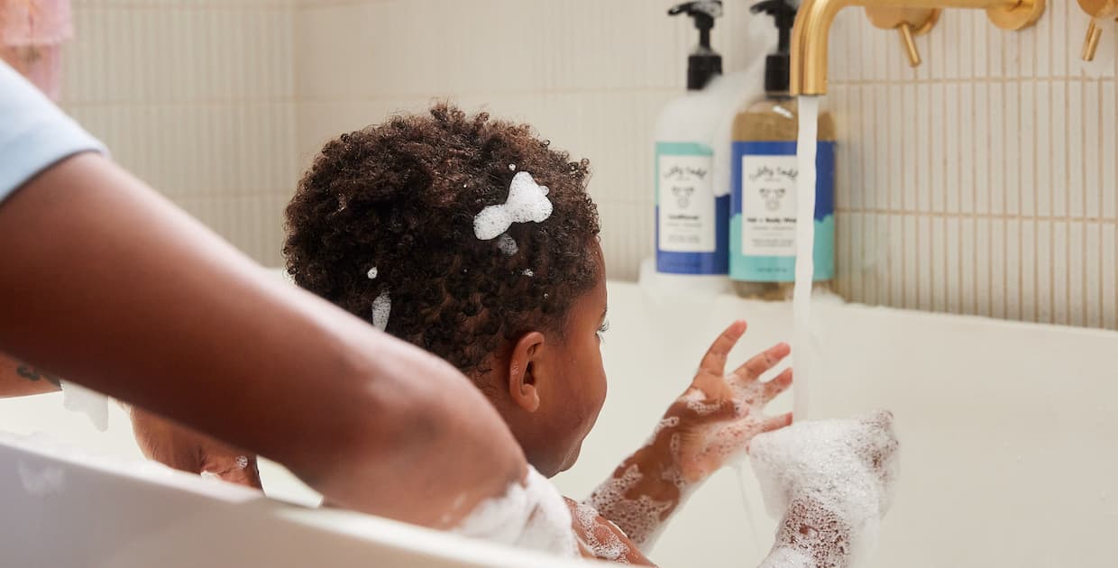 baby in bath with tubby todd products