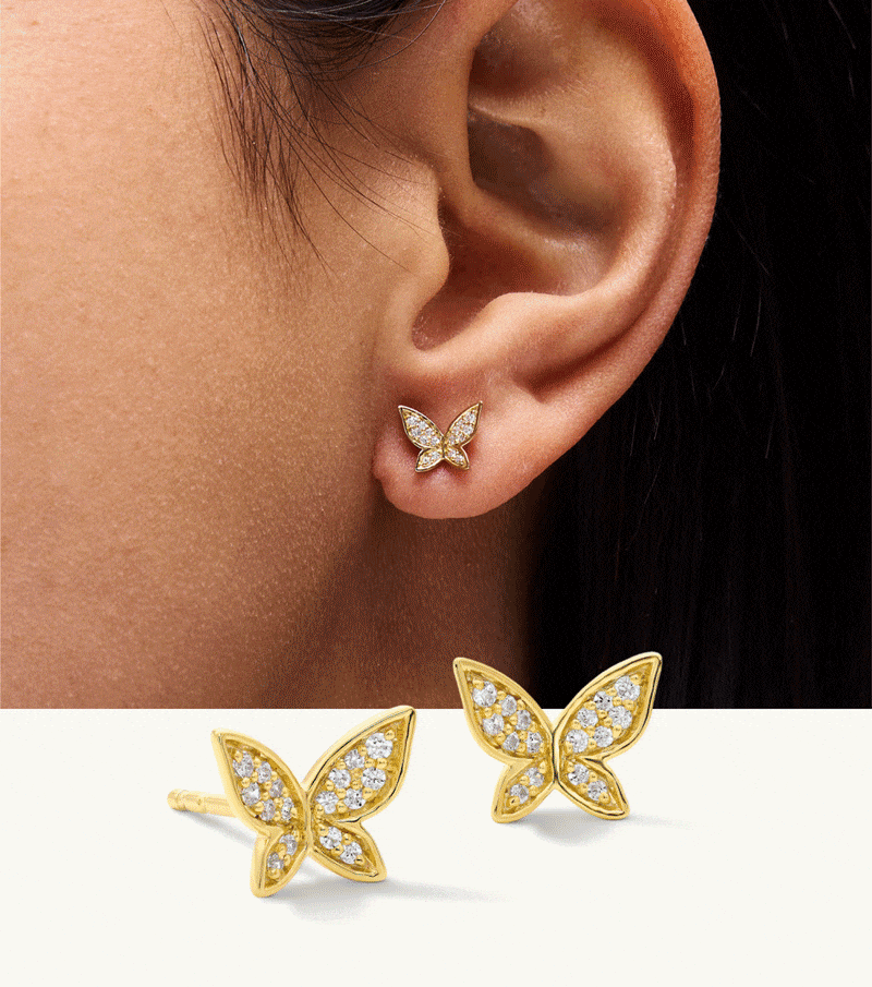 Rotating images of models wearing gemstone earrings and rings.