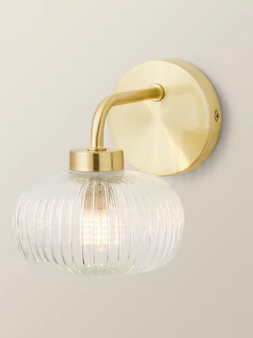 Amaia IP44 Gold Wall Light with Clear Glass Shade