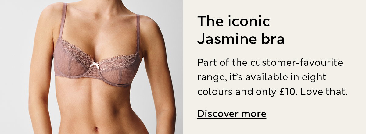Woman wearing the iconic Jasmine Lace Wired Balcony Bra in Praline