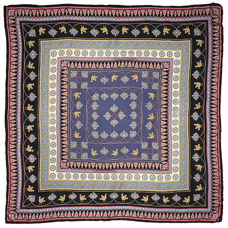 Silk scarf decorated with a floral pattern inspired by ancient Assyrian motifs. - Shop Now.